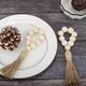 Perles en bois naturel pour le réglage des anneaux de serviette d'art de table glands en jute