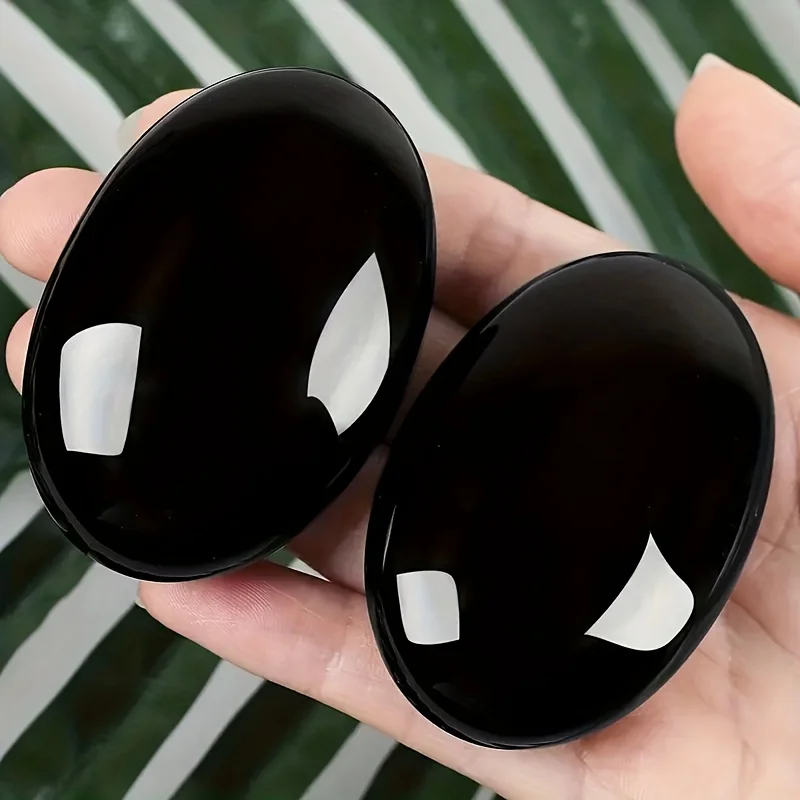 Natürlicher Obsidiankristall, elliptischer Chakra-Feldstein, polierter Palmenstein für Energieausgeglichenheitstherapie, Yoga-Meditationsornament Image