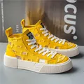 Scarpe di tela Casual da uomo gialle di nuovo Design scarpe da ginnastica alte con plateau stringate