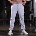 Per uomo Pantaloni della tuta Pantaloni Running Pantaloni da pista Tasche A cordoncino Cinturino elastico Pantalone / Sovrapantaloni Esterno Sportivo Al coperto Autunno Cotone Traspirante Morbido