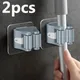 1/2pcs Portaoggetti per bagno Porta scopa Organizzatore a parete Gancio per scopa Clip per scopa Appeso a parete Porta scopa Ganci autoadesivi