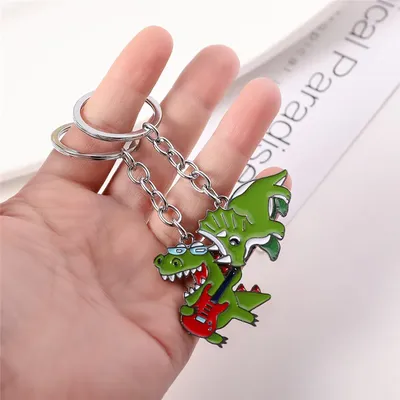 Trendy Metall Dinosaurier Spielen Instrument Schlüssel Kette Männer Frauen Keychain