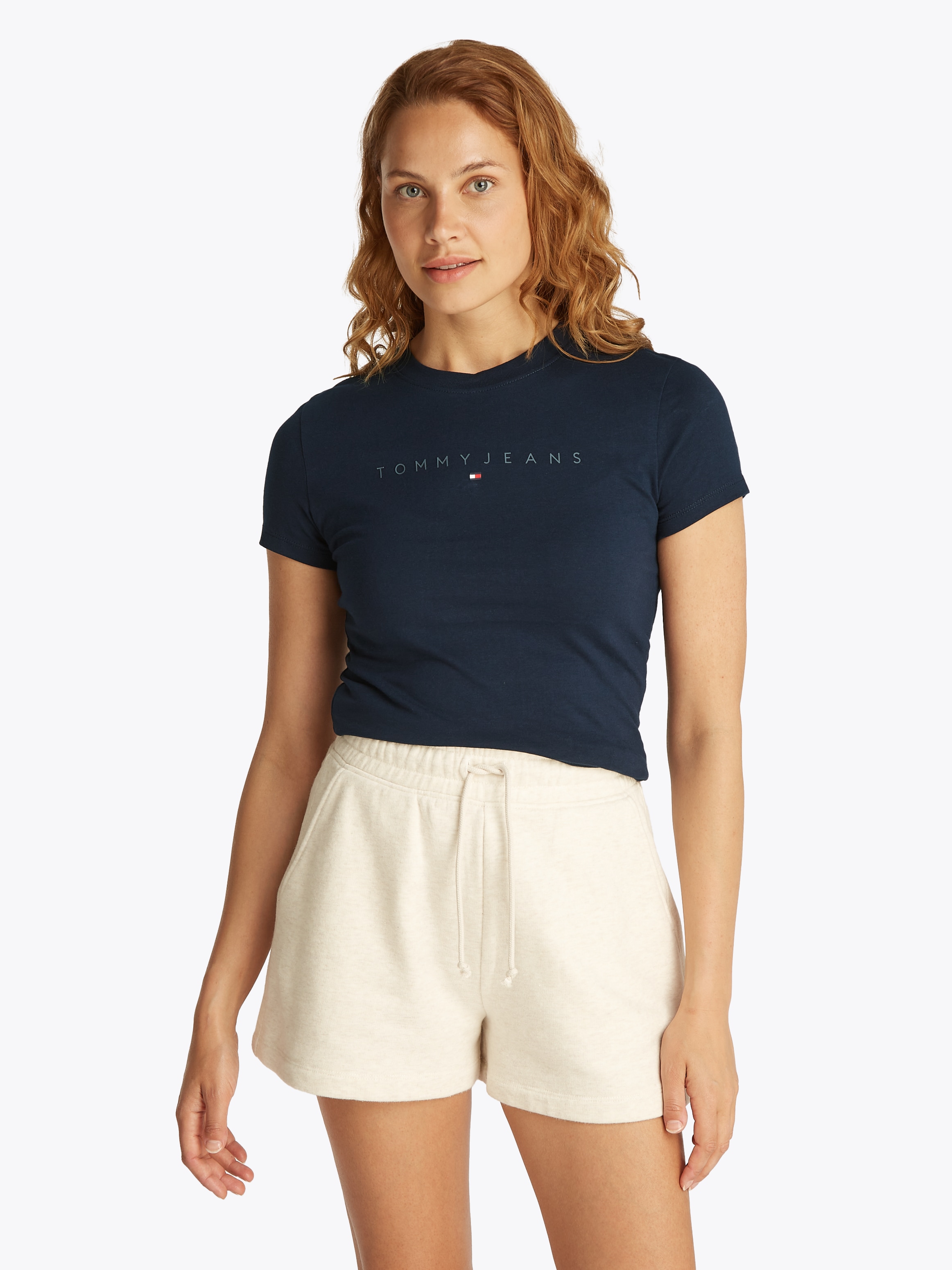 T-Shirt TOMMY JEANS "TJW SLIM TONAL LINEAR TEE EXT", Damen, Gr. XL (42), blau (schwarz night navy), Single Jersey, Obermaterial: 100% Baumwolle, bedruckt, Basic, slim fit kurz, Rundhals, abgesteppt, Shirts, mit Logoschriftzug Image