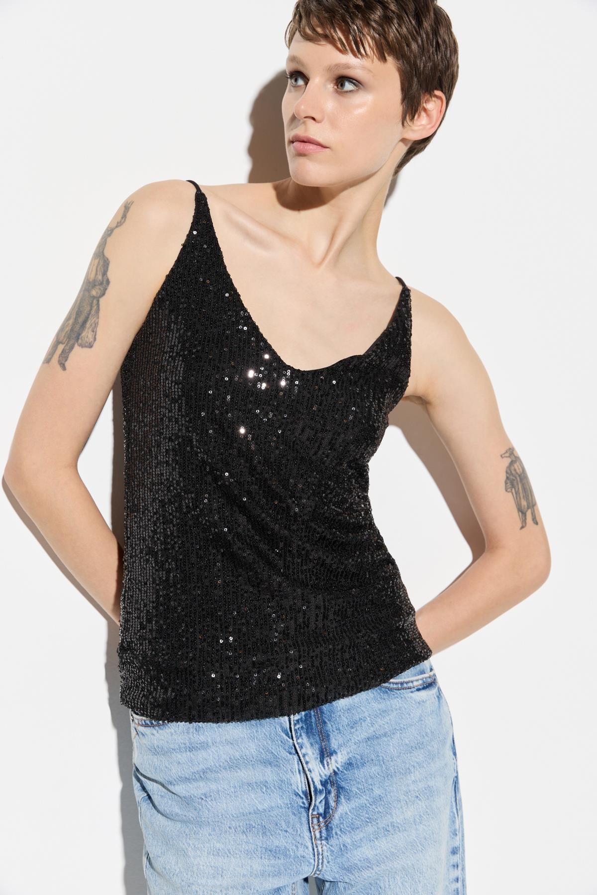 Glitzernde Schulterbluse Image