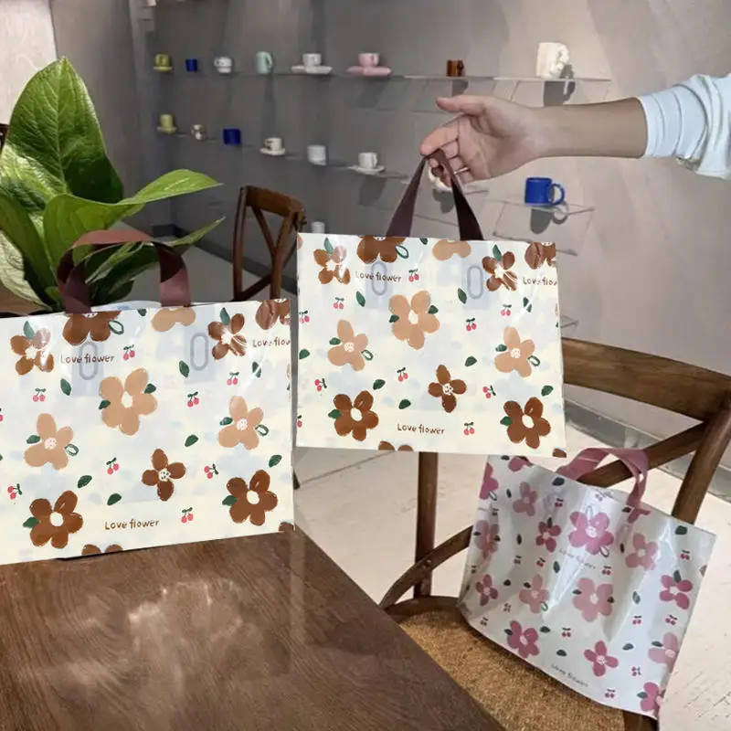 100/50 Stück Kunststoff-Verpackungsbeutel mit Griff, transparent, zum Einkaufen, Blumen, zum Mitnehmen, Geschenktüte, Küchenzubehör Image