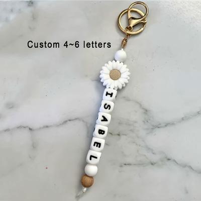 TEMU [customization] 1pc Customized Personalized Silicone Wooden Keychain, Name Tag Keychain, Day Gift/girls Gift/graduation Teacher's Day Gift (customizable 1~3/4~6/7~9/10~12 Letters) Image