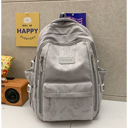 Zaino scolastico stampato beige da donna con grazioso portachiavi in peluche, zaino leggero e di grande capacità per ragazze adolescenti, college e uso quotidiano casual, disponibile in due misure