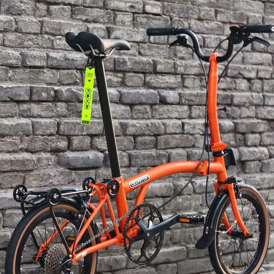 Vitality Orange M/S 9-Gang 16 Zoll leichtes Klappfahrrad Kohlefaser-Lenker Schwalbe-Reifen Outdoor-Fahrrad für Erwachsene