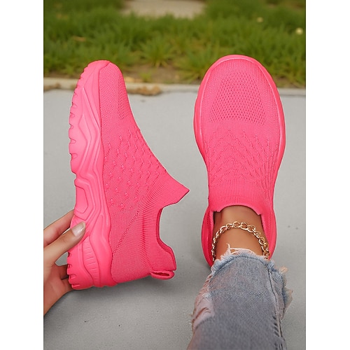 Leuchtend rote Damen-Sportschuhe zum Hineinschlüpfen mit atmungsaktivem Strickmaterial – leichte und bequeme Sneaker für Alltag, Reisen und Freizeit. Image