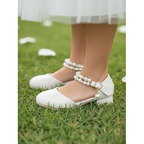 Elfenbeinfarbene Kinder-Blumenmädchenschuhe mit Perlenriemen, Strassverzierungen, weich gepolstertem, niedrigem Absatz und elegantem Prinzessinnenstil – perfekt für Hochzeiten und festliche Anlässe. Image