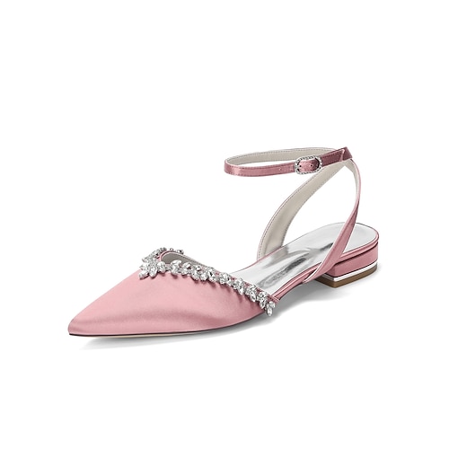 Elegante, elfenbeinfarbene, kristallverzierte Brautschuhe mit Knöchelriemen für eine Gartenhochzeit im Freien Image