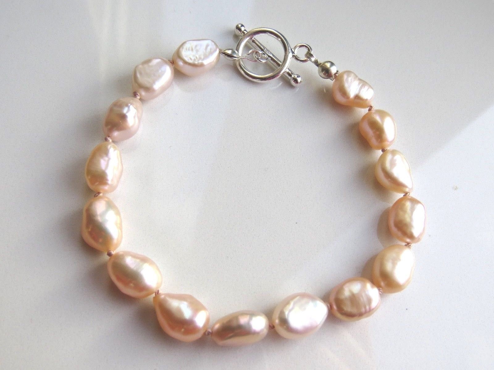 "Bracciale in argento sterling 925 con perle d'acqua dolce color pesca. Bracciale in perle d'acqua dolce da 7,5\". Bracciale in perle d'acqua dolce baro"