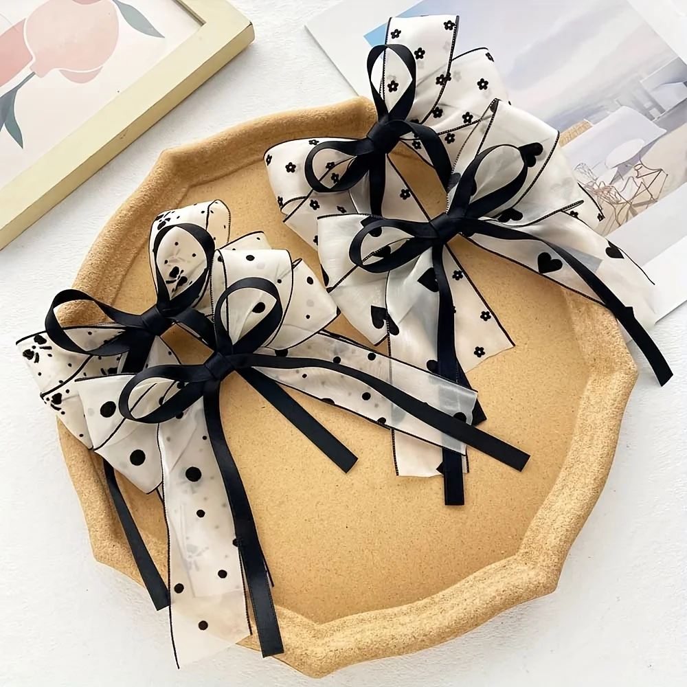 4-teiliges Damen-Haarspangen-Set aus Satin mit langen Bändern, bedruckte Schleifen-Haarspange, mattierte Oberfläche, modische und elegante Haaraccessoires. Image