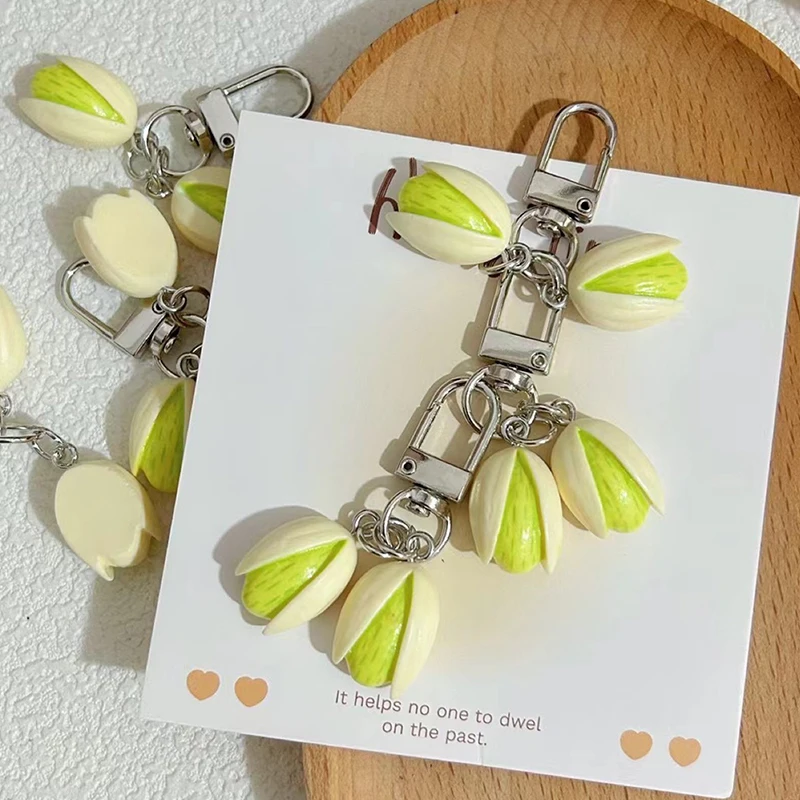 〔R〕Realistischer Pistazien-Schlüsselanhänger – Niedlicher Schlüsselanhänger mit simuliertem Nussanhänger für Taschen- und Handydekoration Image