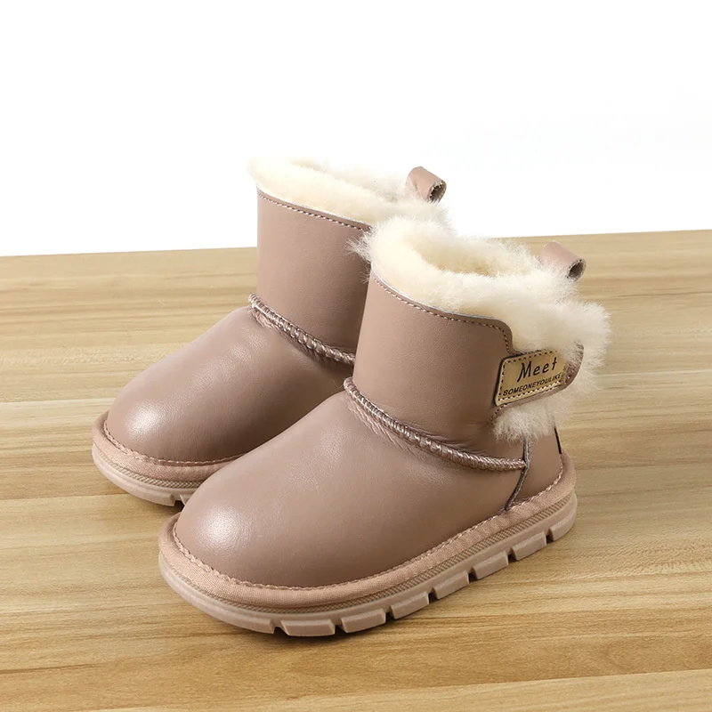 Winter neue Kinder helle Leder Schneeschuhe Kinder stiefel verdickt Schaffell Fell ein Kinderschuhe