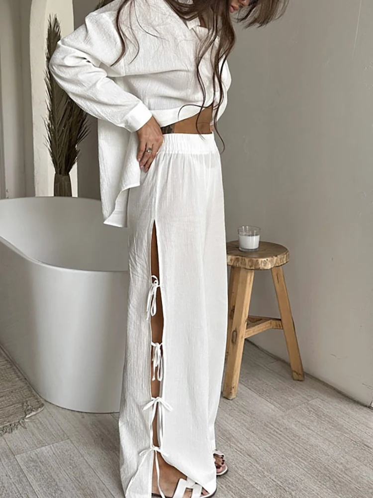 Abito da donna casual allentato solido pantaloni lunghi 2 pezzi elegante camicia a maniche lunghe con risvolto abiti top con bottoni alla moda e set di pantaloni con allacciatura cava