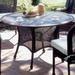 South Sea Rattan Dining Table Glass/Wicker/Rattan in Brown | 29 H x 48 W x 48 D in | Outdoor Furniture | Wayfair 75417-CHO