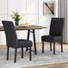 Winston Porter Ruthan Dining Chair Faux Leather/Wood/Upholstered in Black | 39.75 H x 17.75 W x 25 D in | Wayfair 85CC35371192494AA25C197E8E889733