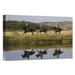 East Urban Home Oregon 'Cowboys Riding Horses w/ Dogs Running Beside Pond' Photographic Print on Wrapped Canvas in White | Wayfair