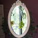 Ophelia & Co. Nahua Carving Frame Oval Accent Mirror Metal | 25.4 H x 15.7 W x 2 D in | Wayfair CC3391C8AD674BAE917811FCE0CFE666