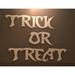 The Holiday Aisle® Trick or Treat Halloween Sign Wood in Brown | 8 H x 37 W x 0.5 D in | Wayfair C2795867134A4ACE836A101527E7ABB4