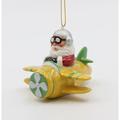 The Holiday Aisle® Santa Driving an Airplane Hanging Figurine Ornament Ceramic/Porcelain in White/Yellow | 2.5 H x 3.375 W x 3.375 D in | Wayfair