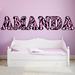 Zoomie Kids Humberto Zebra Print Name Personalized Wall Decal Vinyl/Plastic in Pink | 8 H x 26 W x 0.01 D in | Wayfair