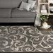 Gray/White 79 x 0.27 in Area Rug - Winston Porter Sitz Floral Machine Made Power Loom Indoor/Outdoor Area Rug in Stone/Snow | Wayfair